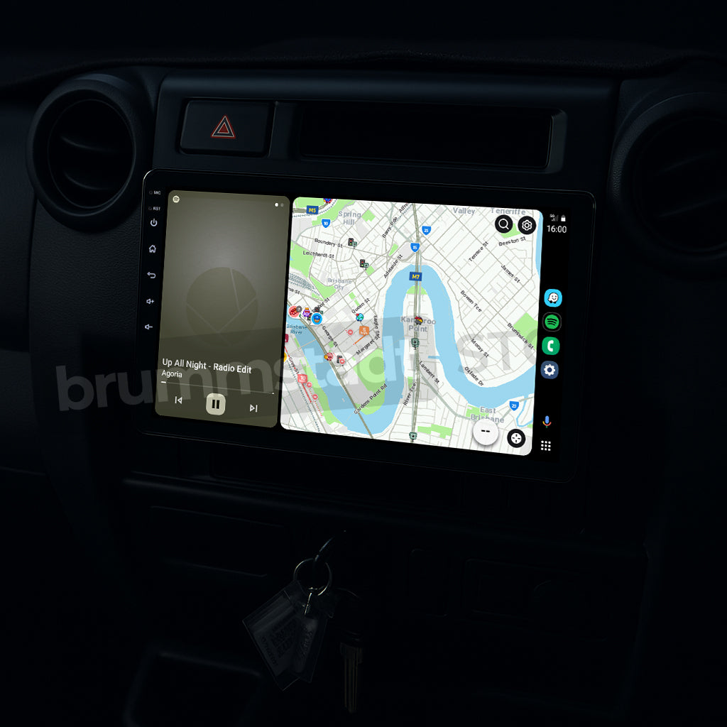 Brummstadt, Toyota Land Cruiser 70 1984-2025, Toyota Land Cruiser 70 head unit displaying Android Auto interface, featuring Google Maps with route navigation, Spotify app playing "Up All Night" by Radio Edit, visible map details, and app icons on the right side. The screen shows a clear layout with time, battery status, and network signal, enhancing user experience with seamless connectivity and intuitive controls.