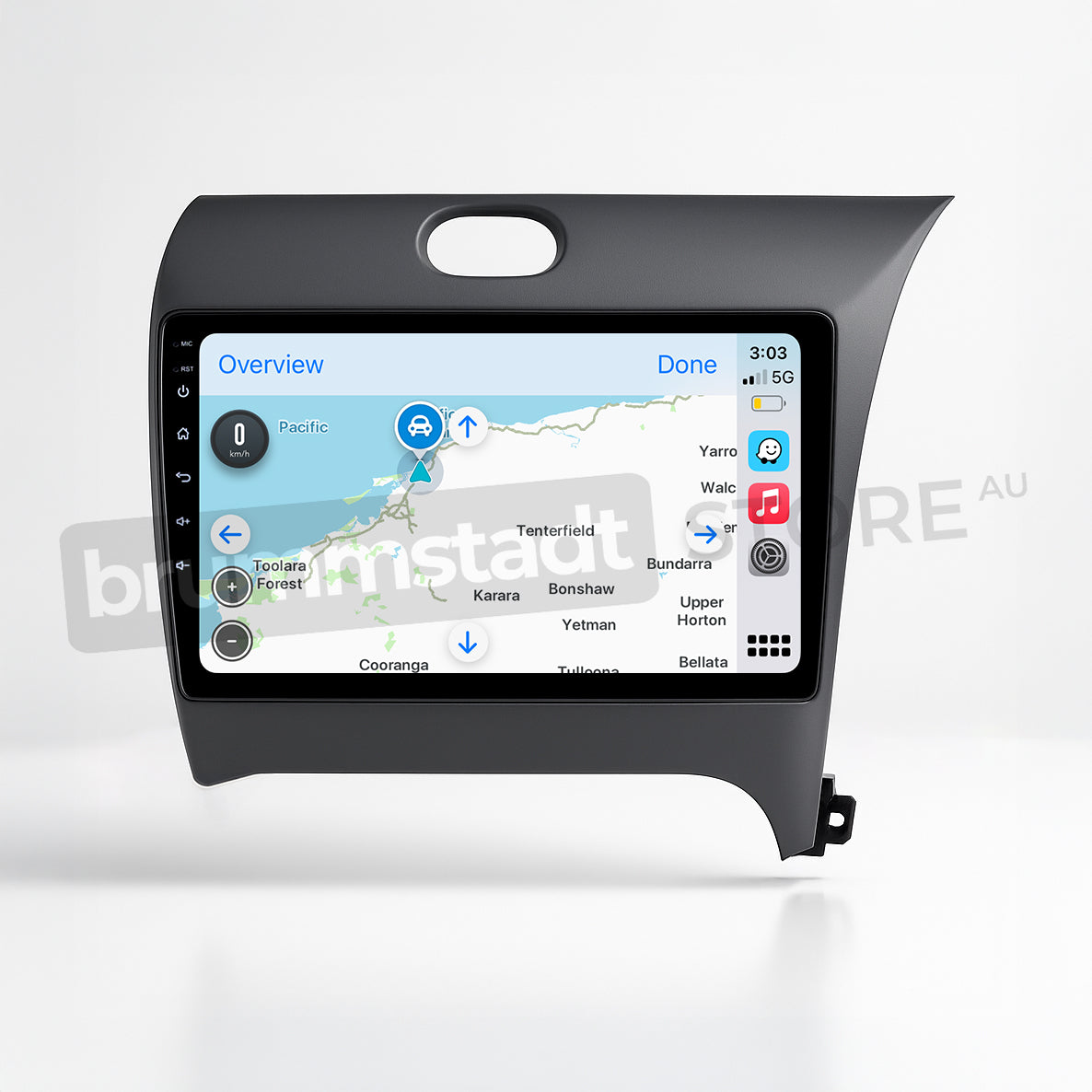 Brummstadt, Kia Cerato 2013-2018, premium head unit featuring Apple CarPlay, showcasing a map interface with location markers, time displayed as 3:03, 5G network status, and battery indicator. Visible apps include Maps and Phone, with a clear layout for easy navigation. The sleek design integrates seamlessly into the dashboard, enhancing user experience with wired and wireless connectivity options.