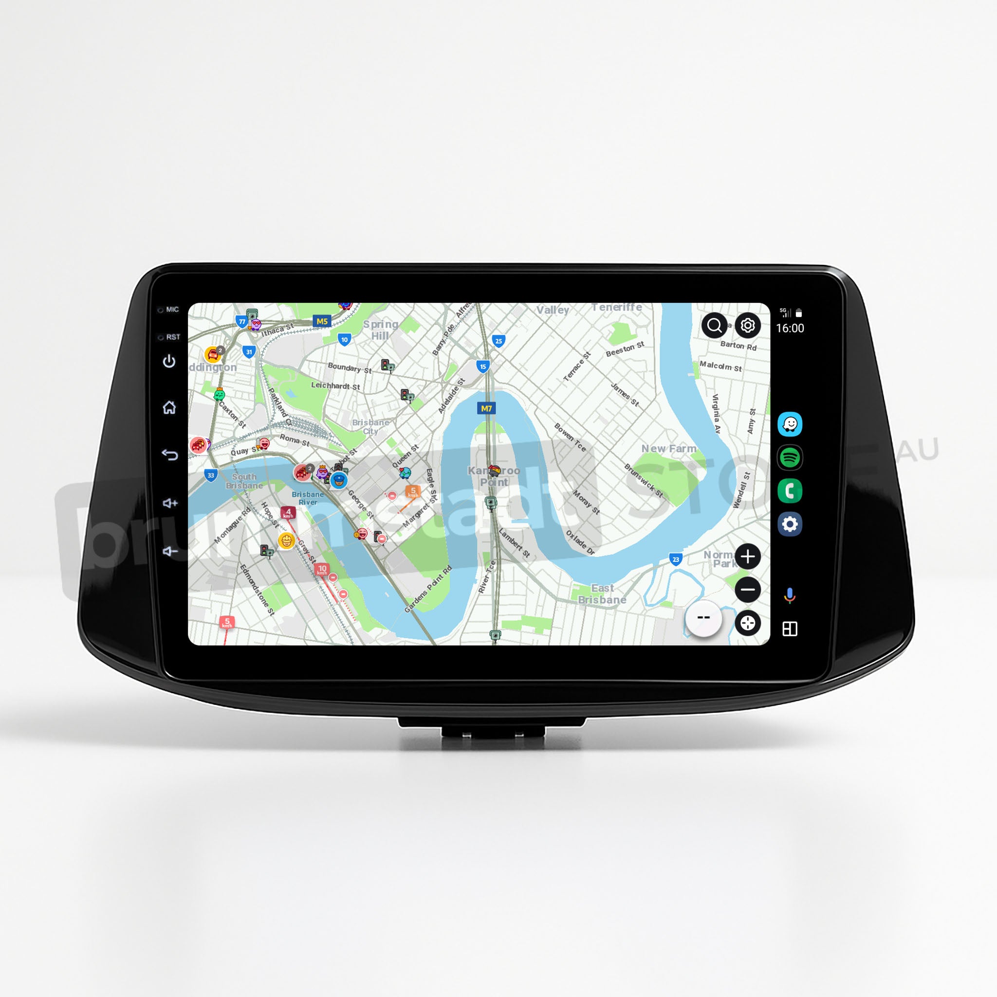 Brummstadt, Hyundai i30 2017-2022, Hyundai i30 head unit displaying Apple CarPlay interface, featuring a detailed map view with navigation routes, app icons on the left side, time displayed as 16:00, and various app notifications. The screen shows a river and city layout, enhancing user navigation experience. Apple CarPlay interface is evident with distinct app layout and connectivity options.